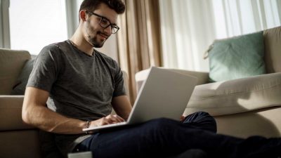 Young-man-studying-and-working-on-laptop-at-home2